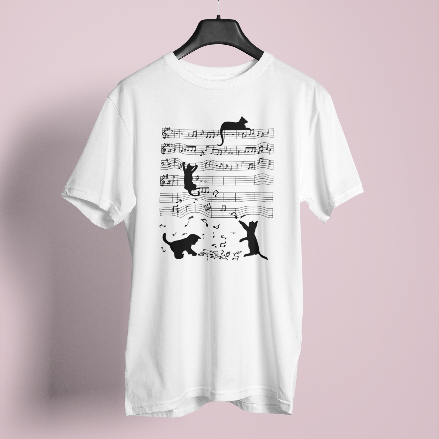 White t-shirt with black cat and music note design on a pink background