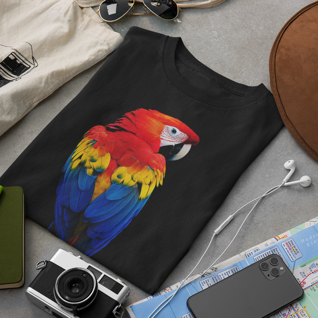 Bright scarlet macaw parrot with red, yellow and blue feathers on a black t-shirt